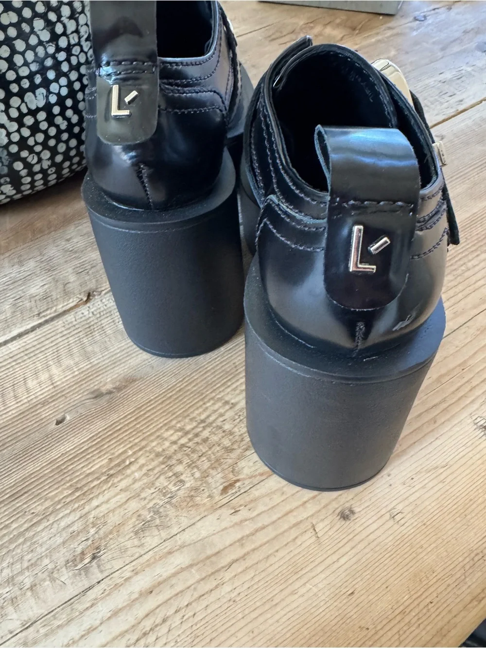 Larroude Black Patent Platform Loafers with Silver Eyelets